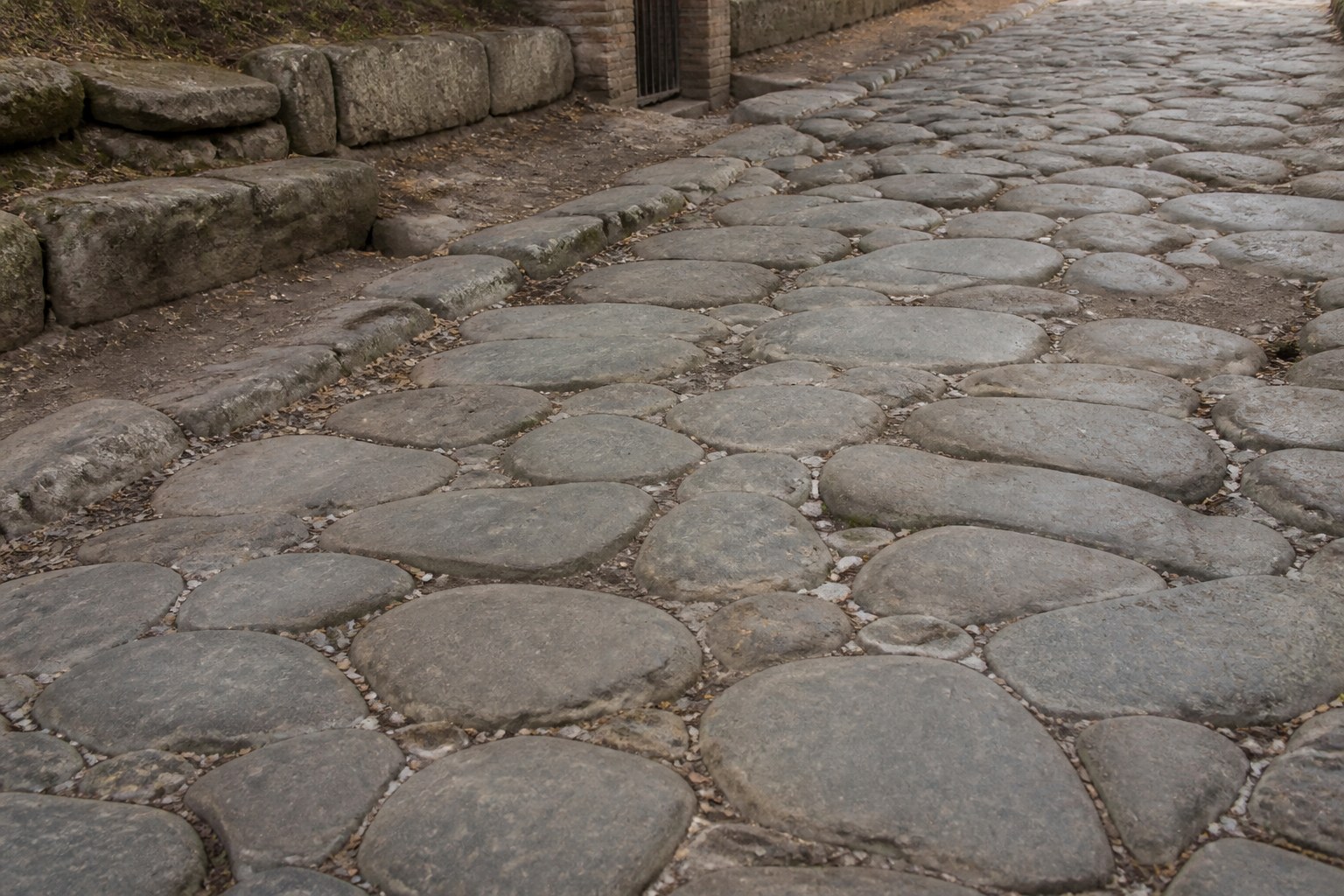A stretch of old Roman road surface with large fitted paving stones