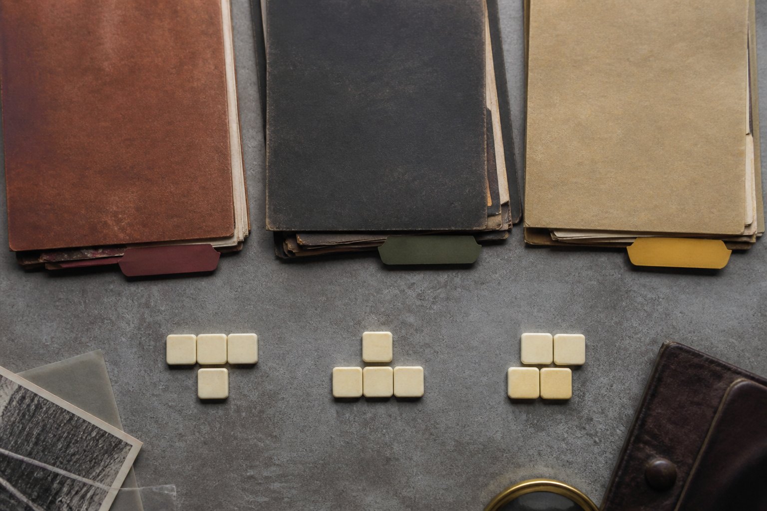 Three numbered archival folders marked 33, 43, and 44 with distinct letter-group diagrams