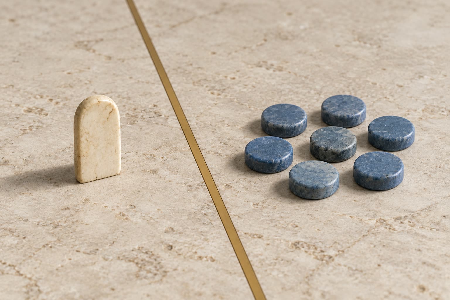 One ivory counting token separated from a group of blue counting tokens on a museum display surface