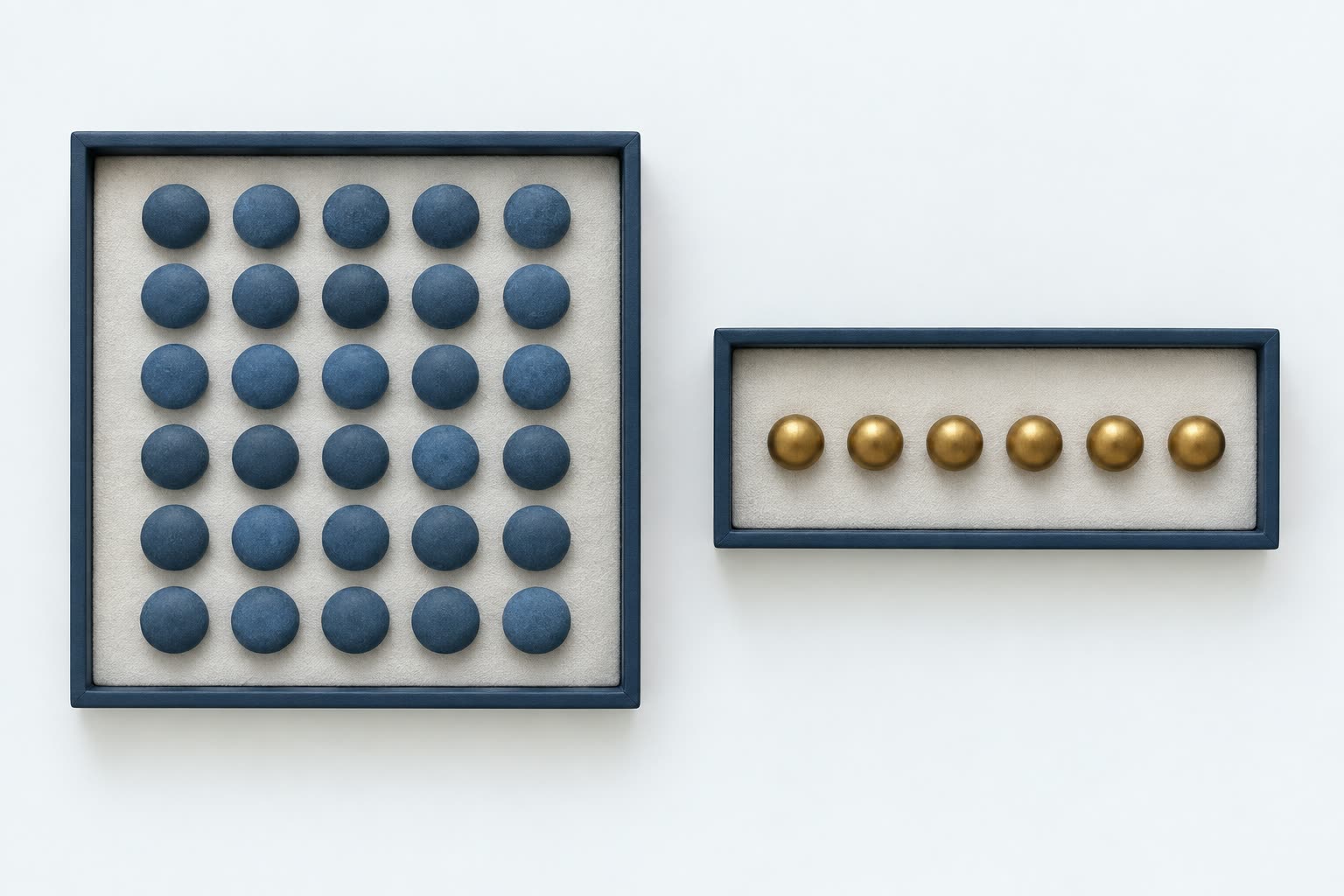 Thirty blue counters in one tray and six brass counters in a separate tray