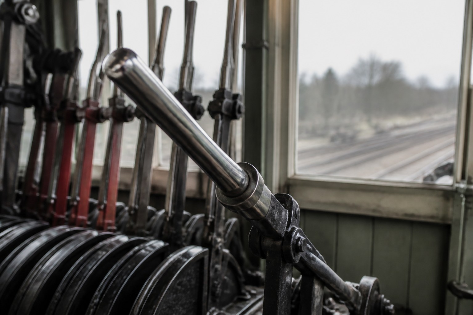 A signal lever pulled hard over in an old railway signal box
