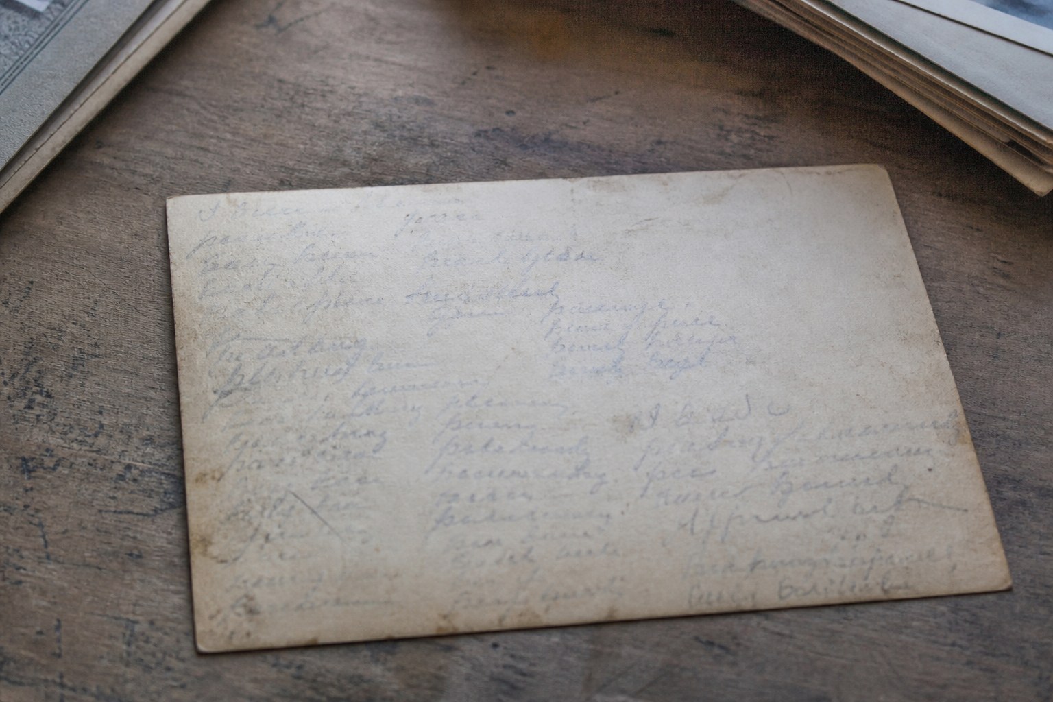 The reverse of an old group photograph covered in handwritten names