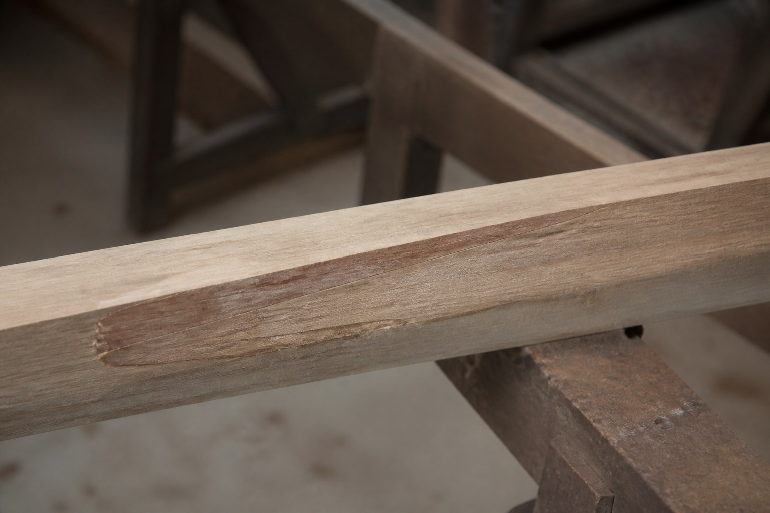 A long scarf joint glued along a boat timber, the taper running out to nothing