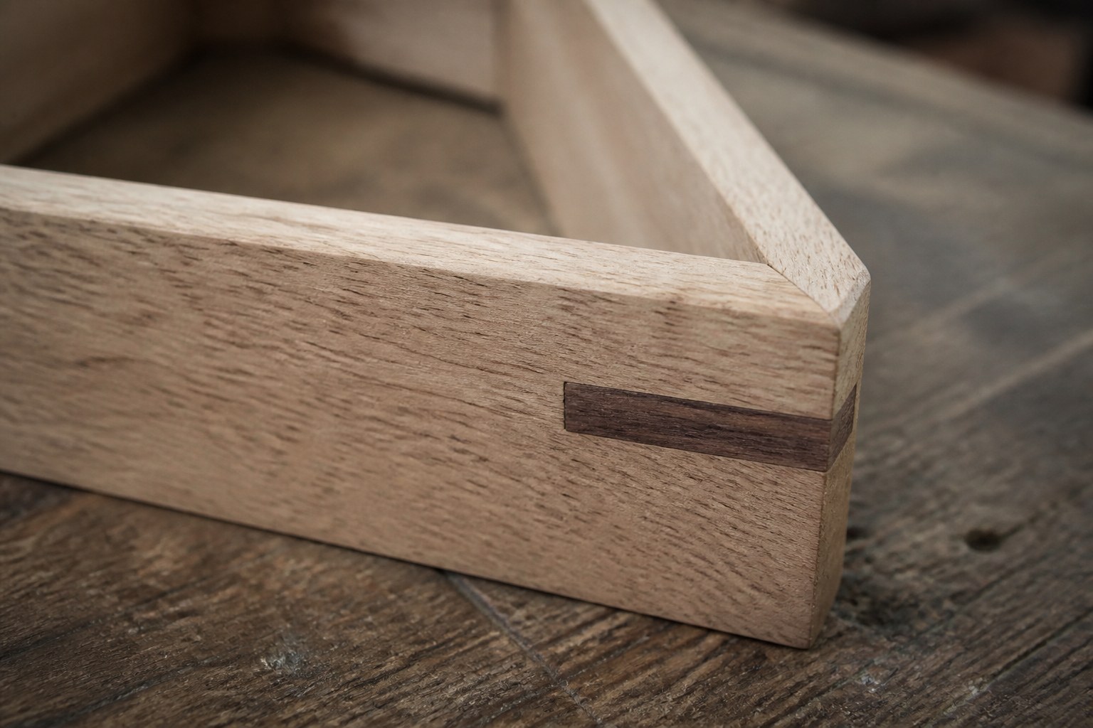 A mitred corner with a contrasting hardwood spline driven through it