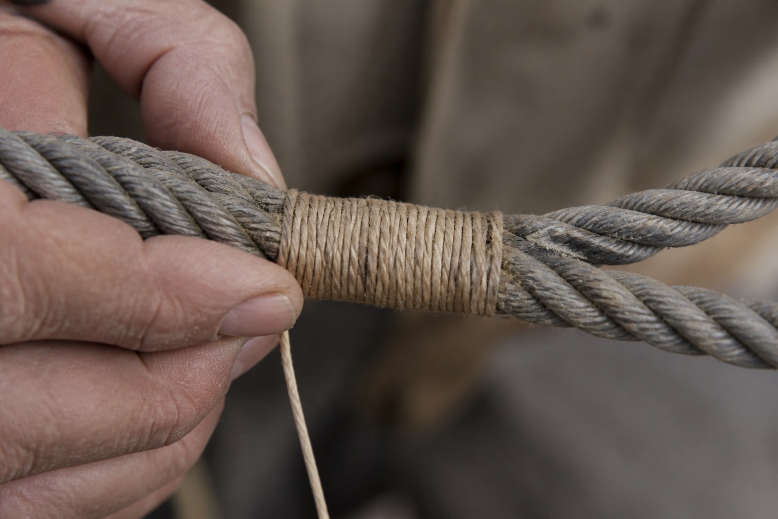 A whipping of waxed twine bound over a cut rope end