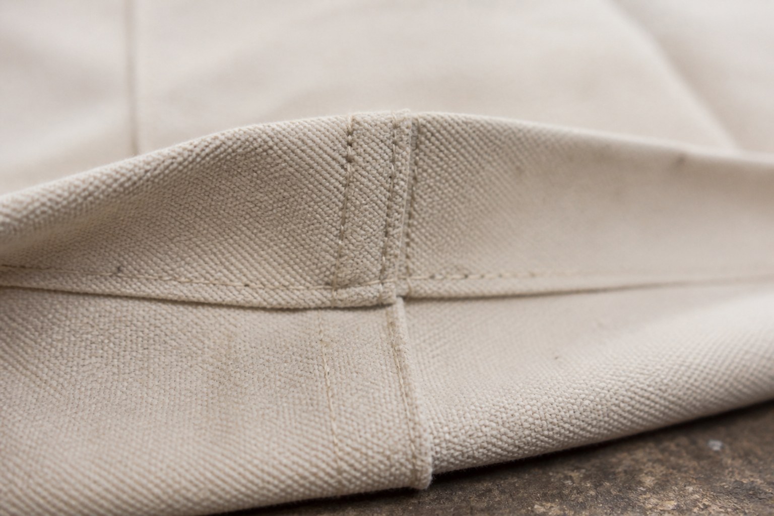 A flat felled seam sewn in heavy cotton canvas