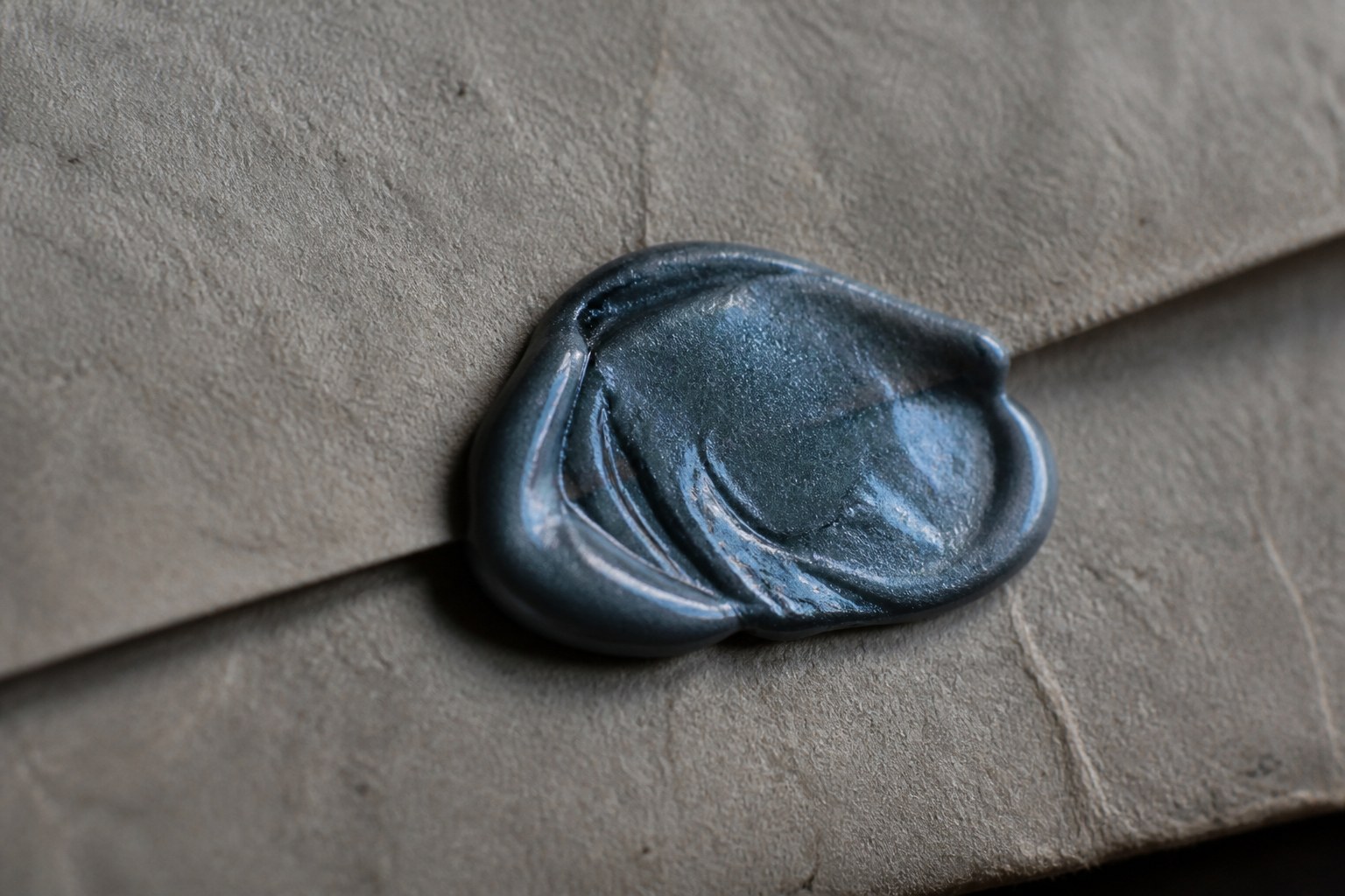A wax seal closing the folded flap of a letter